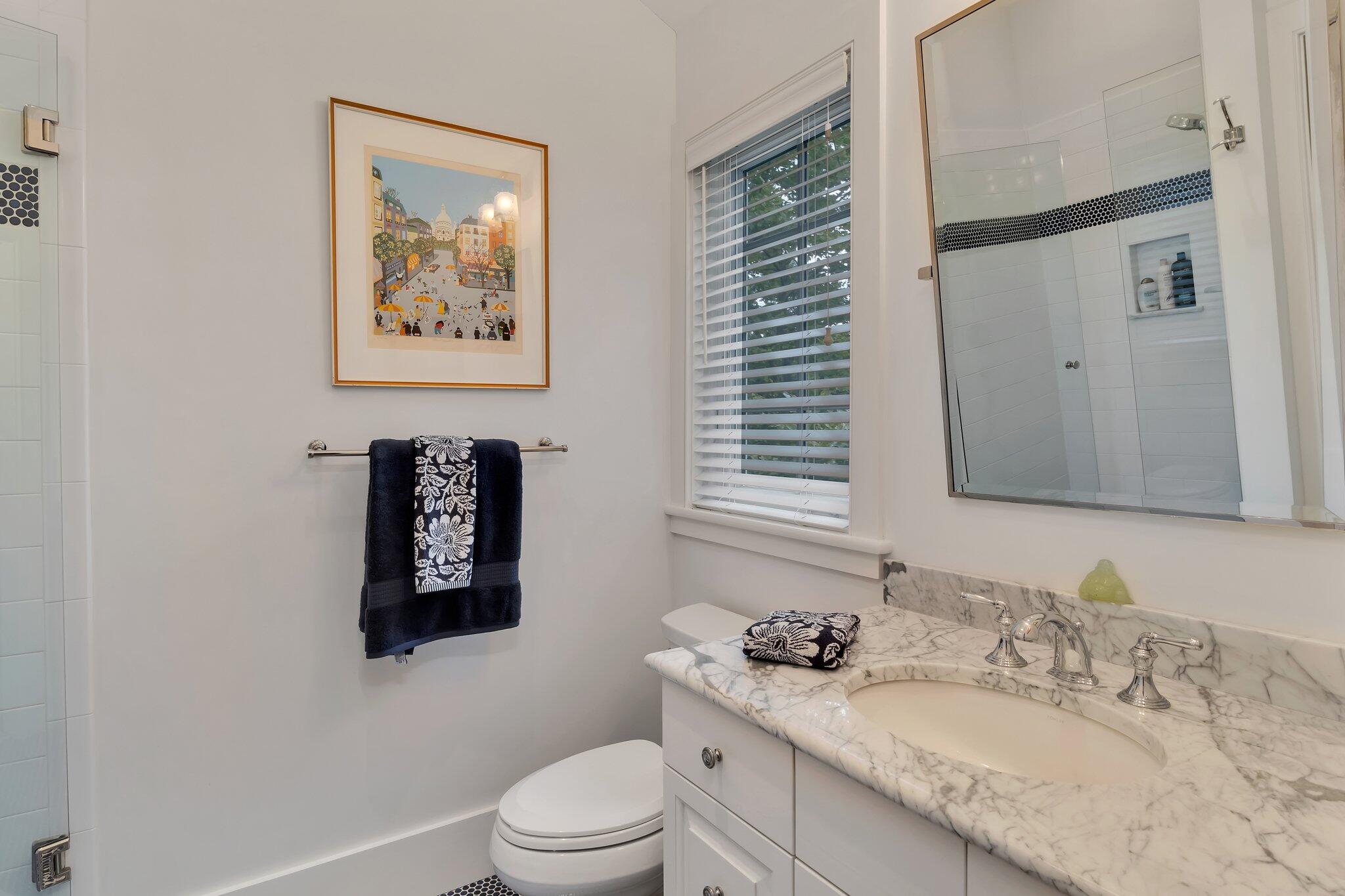 345 Windswept Way Osterville, MA 02655 - Photo 48 of 66 a bathroom with a granite countertop sink mirror vanity and toilet