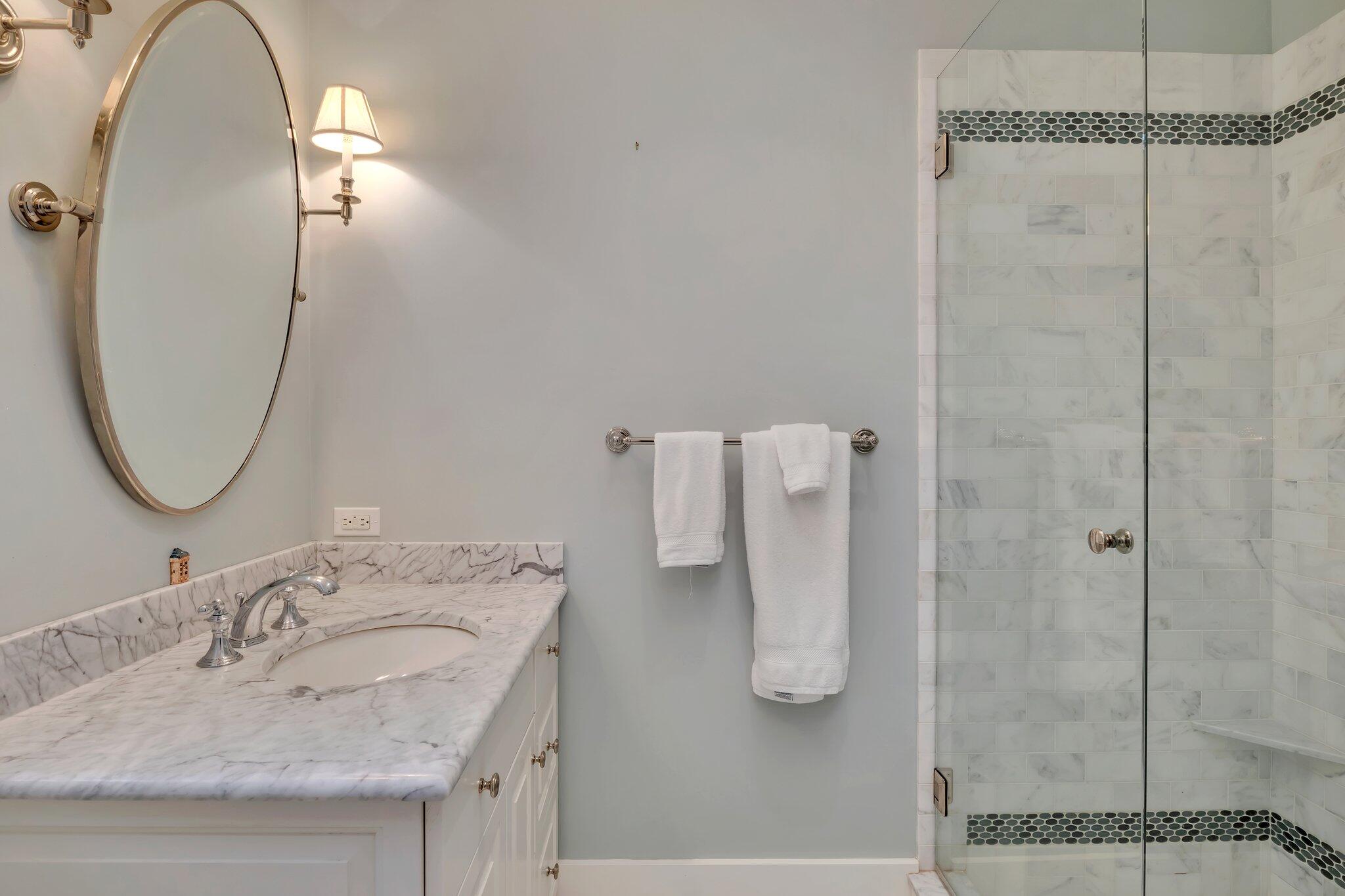 345 Windswept Way Osterville, MA 02655 - Photo 50 of 66 a bathroom with a granite countertop sink and a mirror
