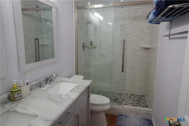 a kitchen with a stove and a refrigerator