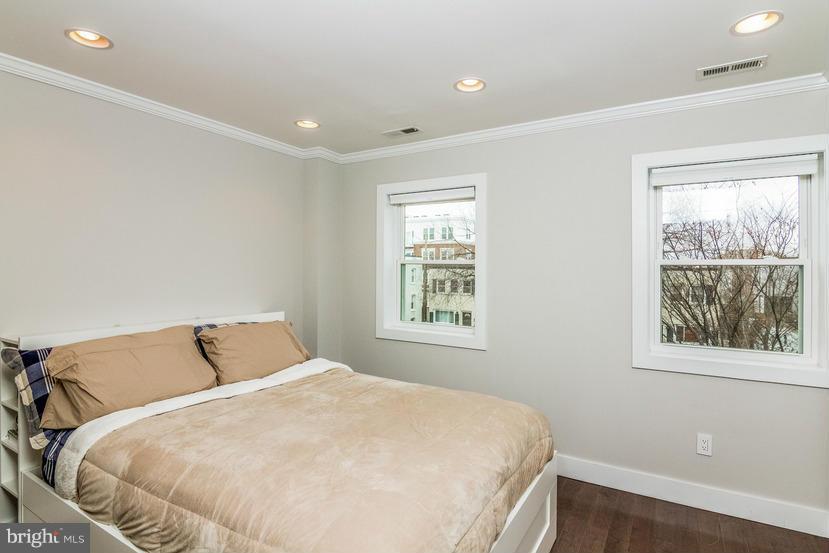 29 17th Street Southeast Washington, DC 20003 - Photo 11 of 30 a bedroom with a bed and window