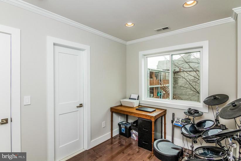29 17th Street Southeast Washington, DC 20003 - Photo 17 of 30 a room with furniture and a window