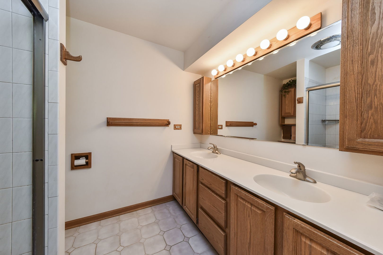 8S526 River Drive Naperville, IL 60565 - Photo 12 of 35 a bathroom with a double vanity sink and mirror