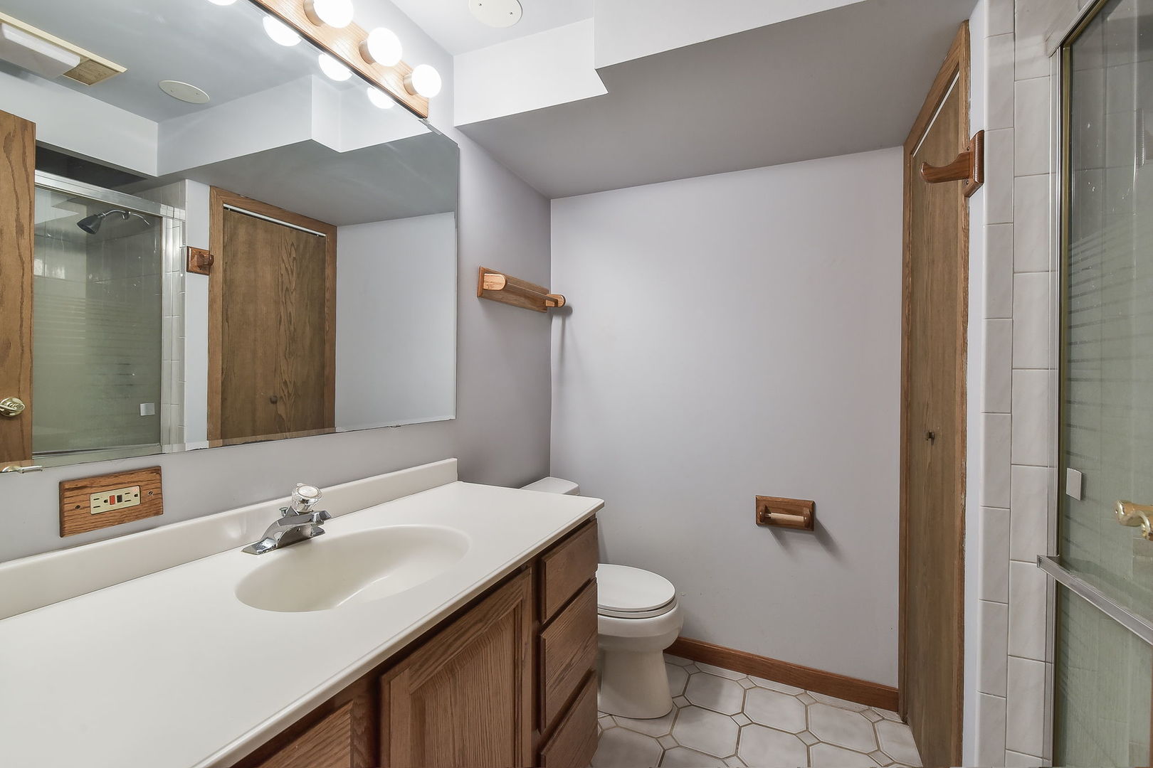 8S526 River Drive Naperville, IL 60565 - Photo 18 of 35 a bathroom with a sink toilet and shower