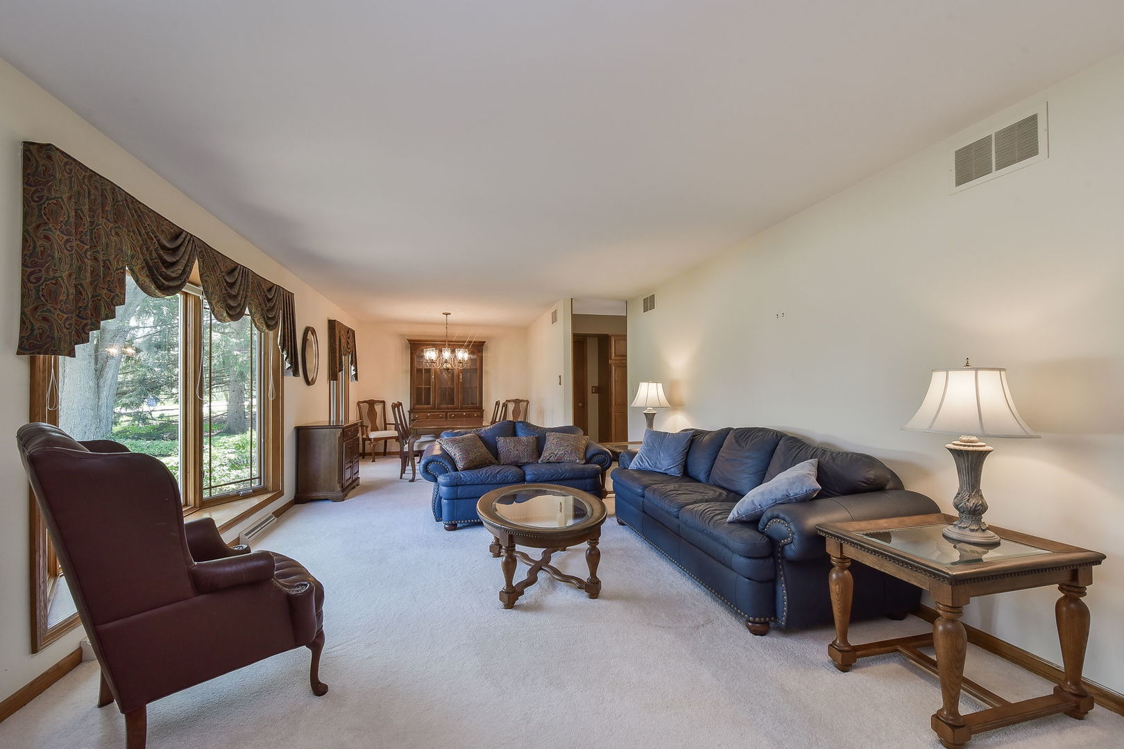 8S526 River Drive Naperville, IL 60565 - Photo 2 of 35 a living room with furniture and a lamp
