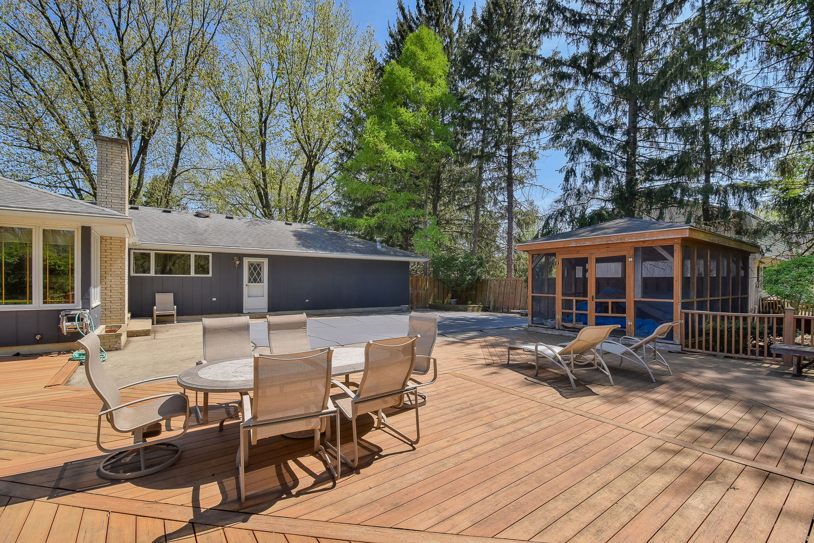 8S526 River Drive Naperville, IL 60565 - Photo 30 of 35 a view of house with patio outdoor seating and covered with trees