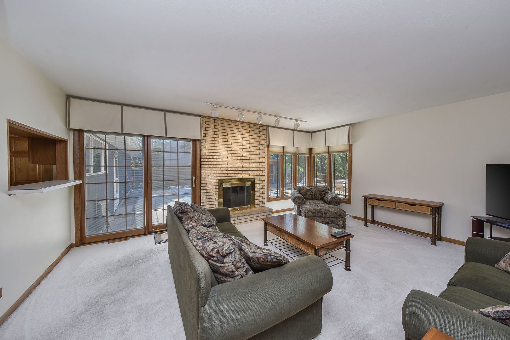 8S526 River Drive Naperville, IL 60565 - Photo 8 of 35 a living room with furniture and a flat screen tv