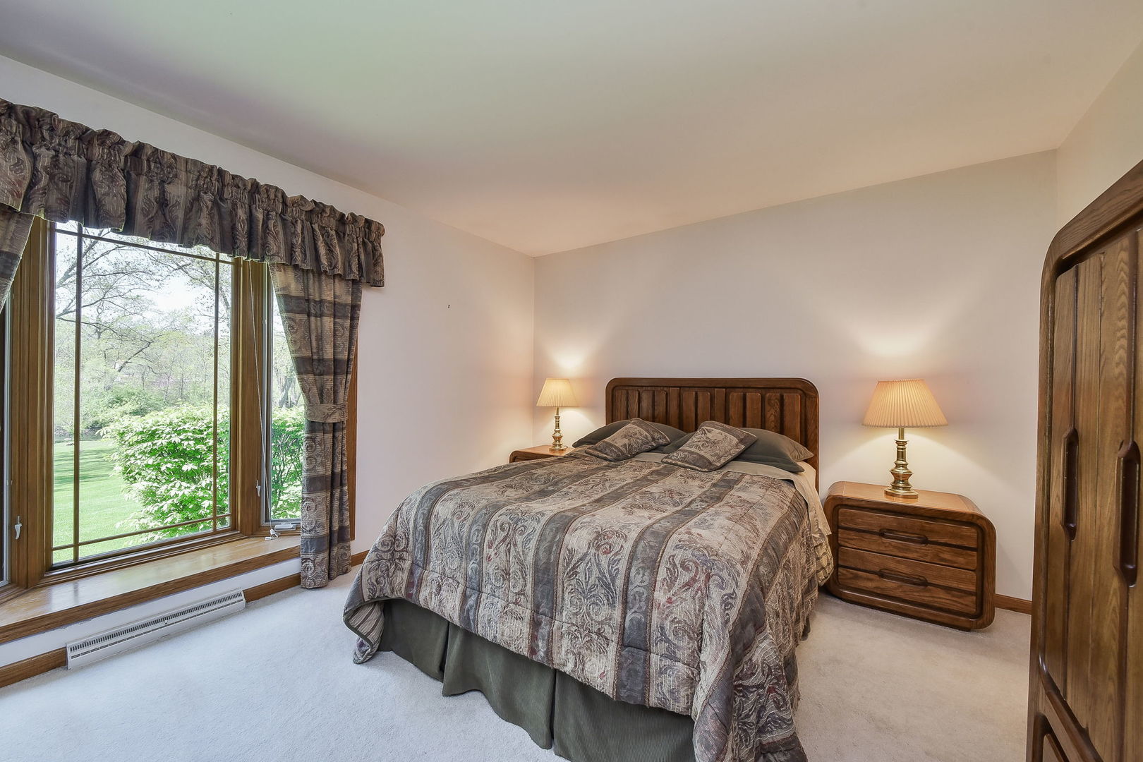 8S526 River Drive Naperville, IL 60565 - Photo 10 of 35 a bedroom with a bed lamp and window