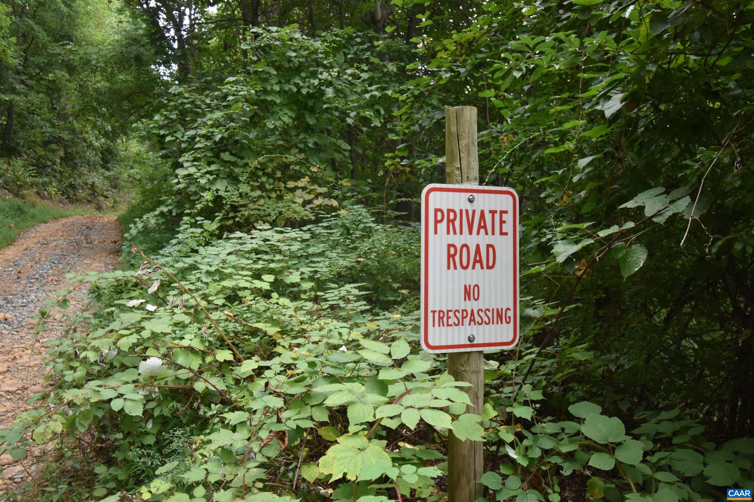 12 Old Mountain Road Stanardsville, VA 22973 - Photo 18 of 28 a sign on the side of a tree