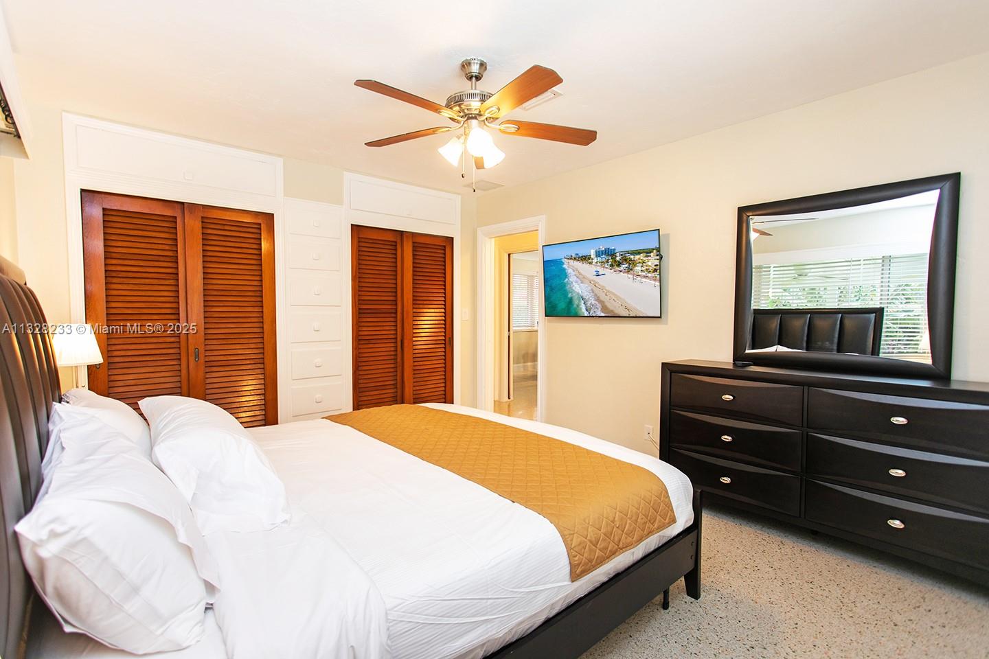 809 South 17th Avenue Hollywood, FL 33020 - Photo 13 of 45 a bedroom with a bed and wooden floor