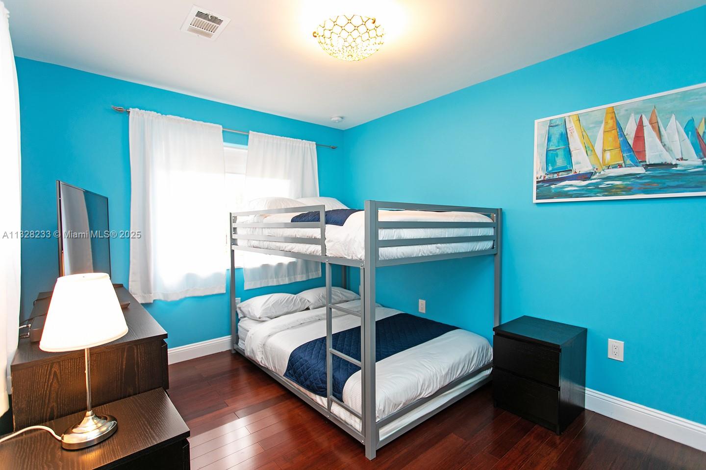 809 South 17th Avenue Hollywood, FL 33020 - Photo 21 of 45 a bedroom with a bed and a dresser