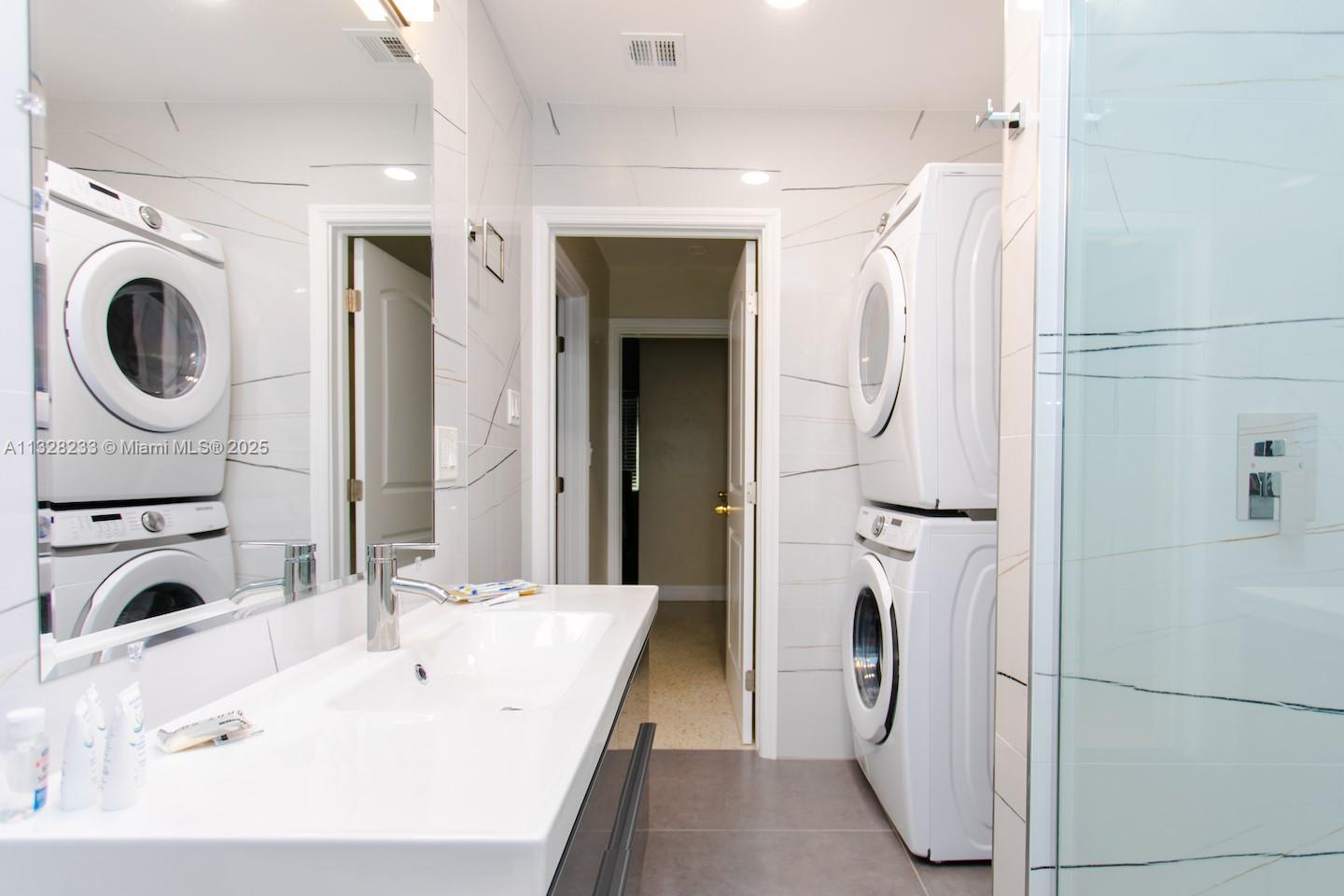 809 South 17th Avenue Hollywood, FL 33020 - Photo 38 of 45 a bathroom with a sink a toilet and a mirror