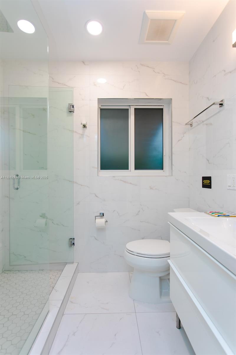 809 South 17th Avenue Hollywood, FL 33020 - Photo 44 of 45 a bathroom with a sink a toilet and shower