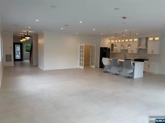 a view of a livingroom with furniture and chandelier