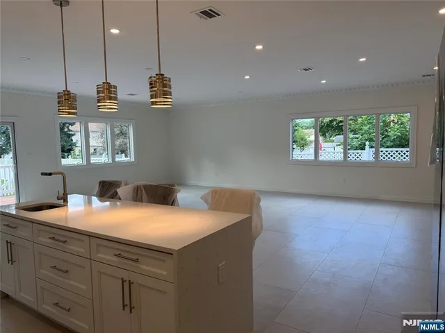 a kitchen with a sink and window