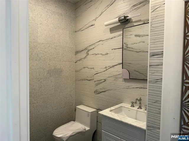 a bathroom with a toilet and sink