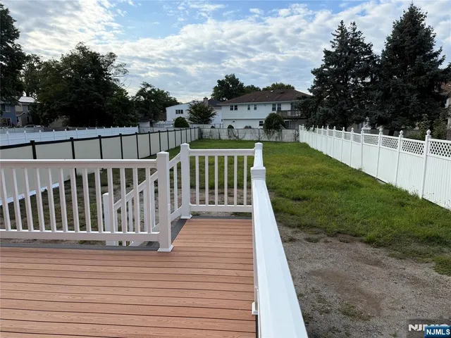 a view of a deck with a yard