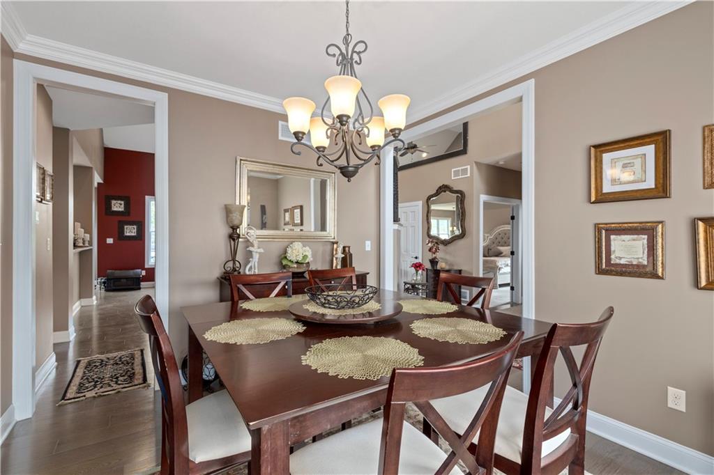 121 Bell Court Road McKees Rocks, PA 15136 - Photo 14 of 25 a view of a dining room with furniture a chandelier and wooden floor