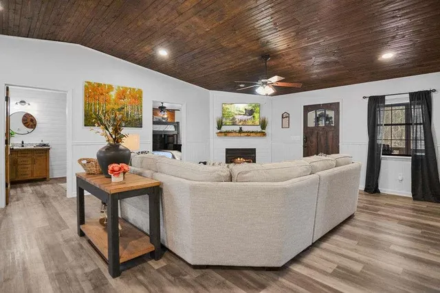 a living room with furniture and a table
