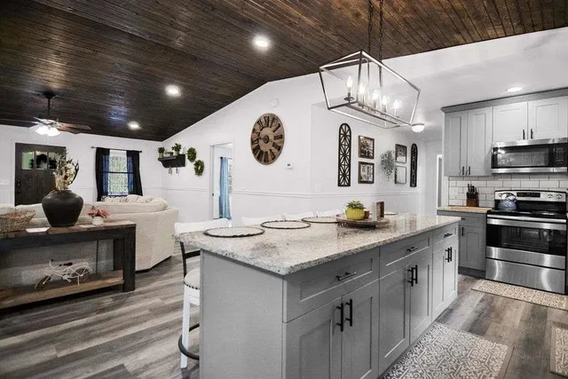 a kitchen with a sink and cabinets
