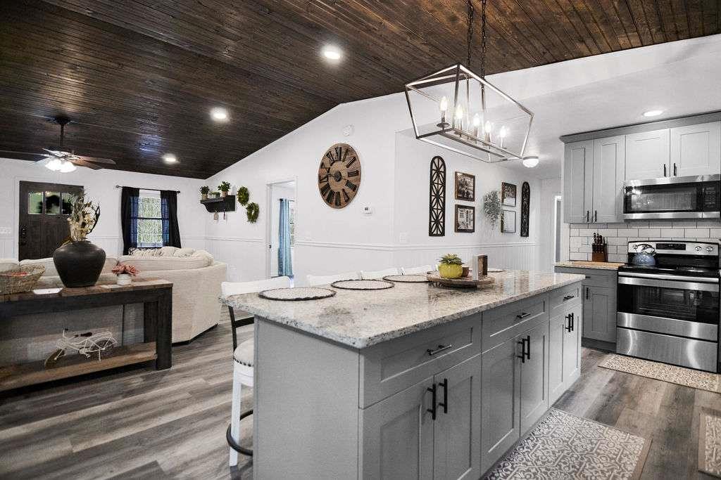 45 Wilderness Trail Blue Ridge, GA 30513 - Photo 14 of 52 a kitchen with stainless steel appliances granite countertop a sink a stove and a refrigerator