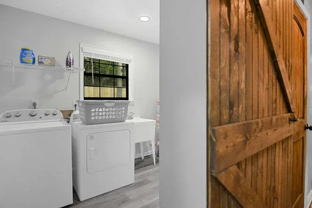 a view of a dining room with a table and chairs