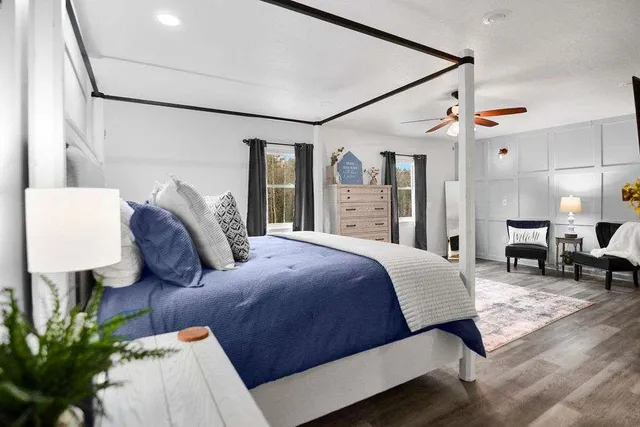 a bedroom with a bed and a fireplace