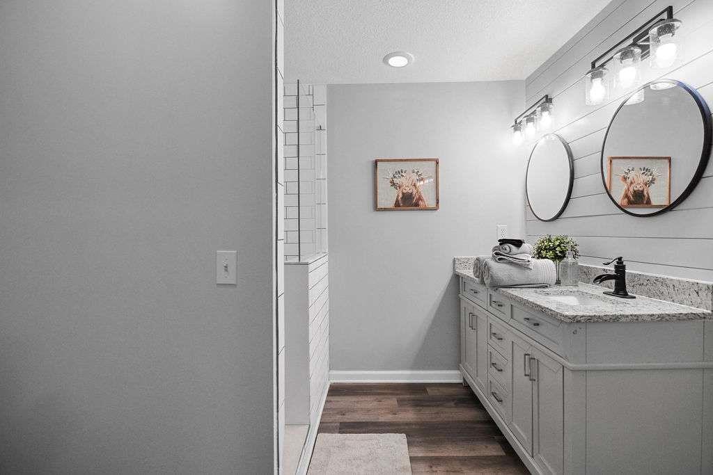 45 Wilderness Trail Blue Ridge, GA 30513 - Photo 40 of 52 a bathroom with a double vanity sink and a mirror