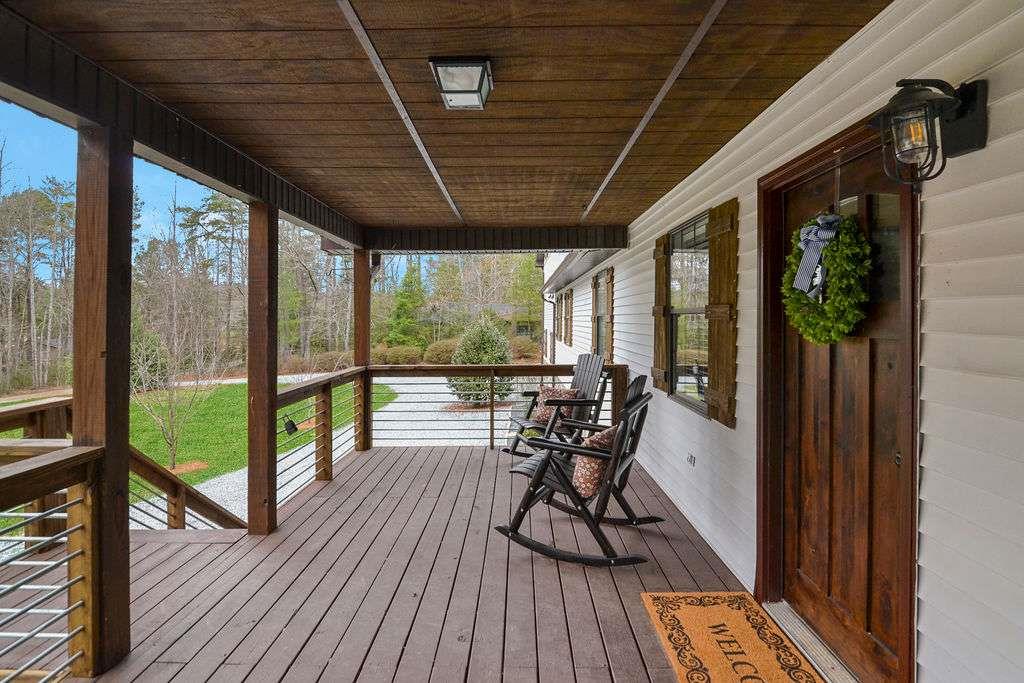 45 Wilderness Trail Blue Ridge, GA 30513 - Photo 4 of 52 a view of a porch with furniture and wooden floor