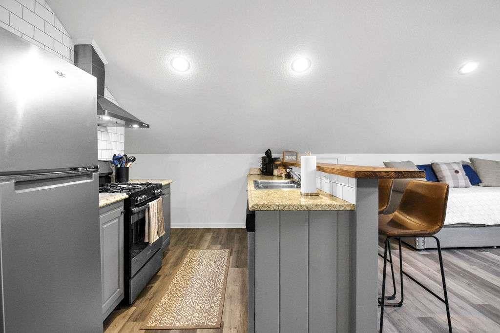 45 Wilderness Trail Blue Ridge, GA 30513 - Photo 46 of 52 a kitchen with granite countertop a sink appliances and cabinets