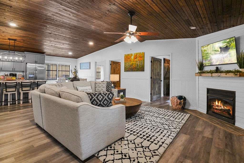 45 Wilderness Trail Blue Ridge, GA 30513 - Photo 9 of 52 a living room with furniture and a fireplace