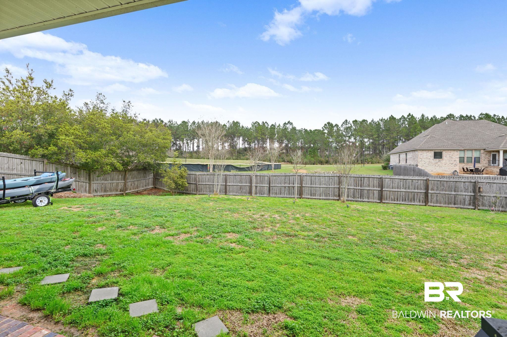12693 Waxwing Avenue Daphne, AL 36527 - Photo 8 of 43 View of fenced backyard