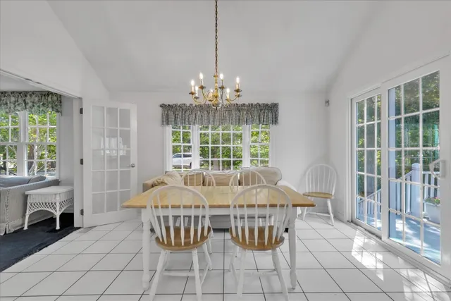 a bed sitting in a room next to a window