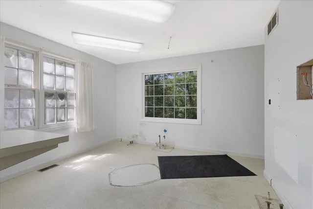 an empty room with windows