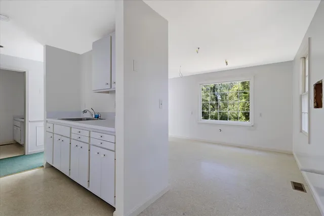 a view of a kitchen cabinets and wooden floor