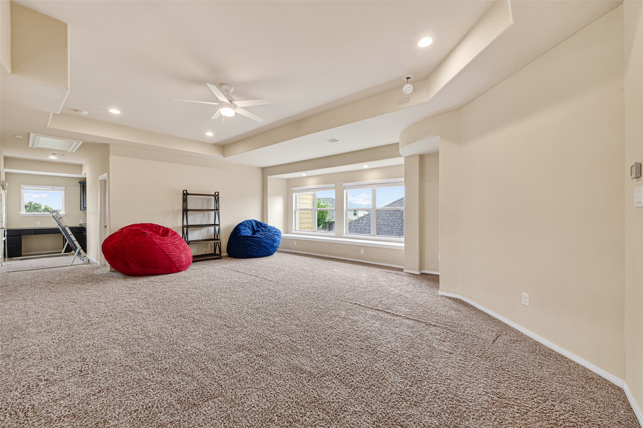 25611 Ellis Ridge Court Katy, TX 77494 - Photo 24 of 49 This spacious room features plush carpeting, recessed lighting, and large windows that let in plenty of natural light. It's versatile, with room for lounging or setting up a home office.