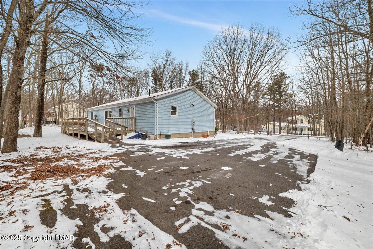 115 Daisy Drive Effort, PA 18330 - Photo 3 of 15 a view of white house with a snow on the road