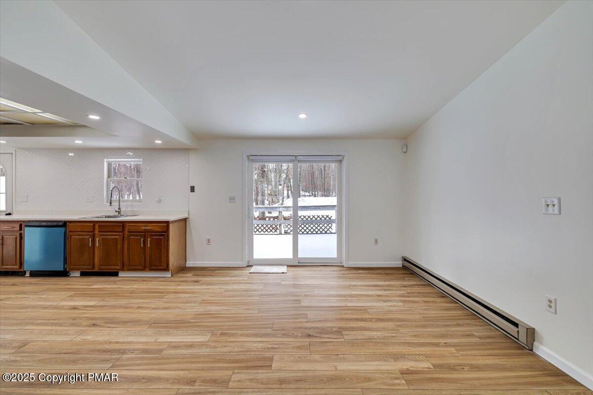 115 Daisy Drive Effort, PA 18330 - Photo 6 of 15 a view of an empty room with wooden floor and a window