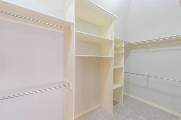 a view of an empty walk in closet