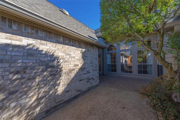 a view of a house with a tree