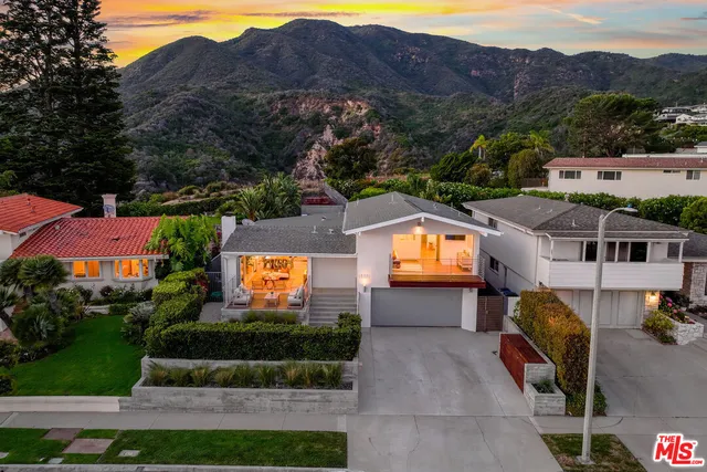 an aerial view of residential houses and outdoor space