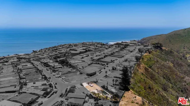 an aerial view of beach and ocean