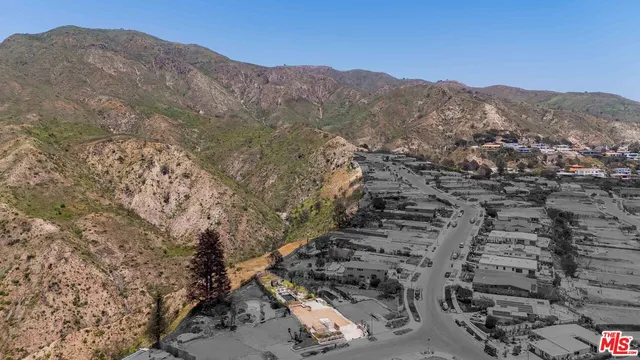 a view of a city with mountains in the background