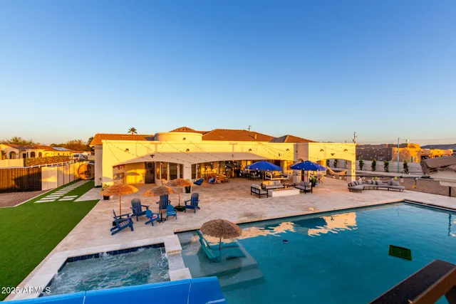 a living room with furniture ceiling fan and a fireplace
