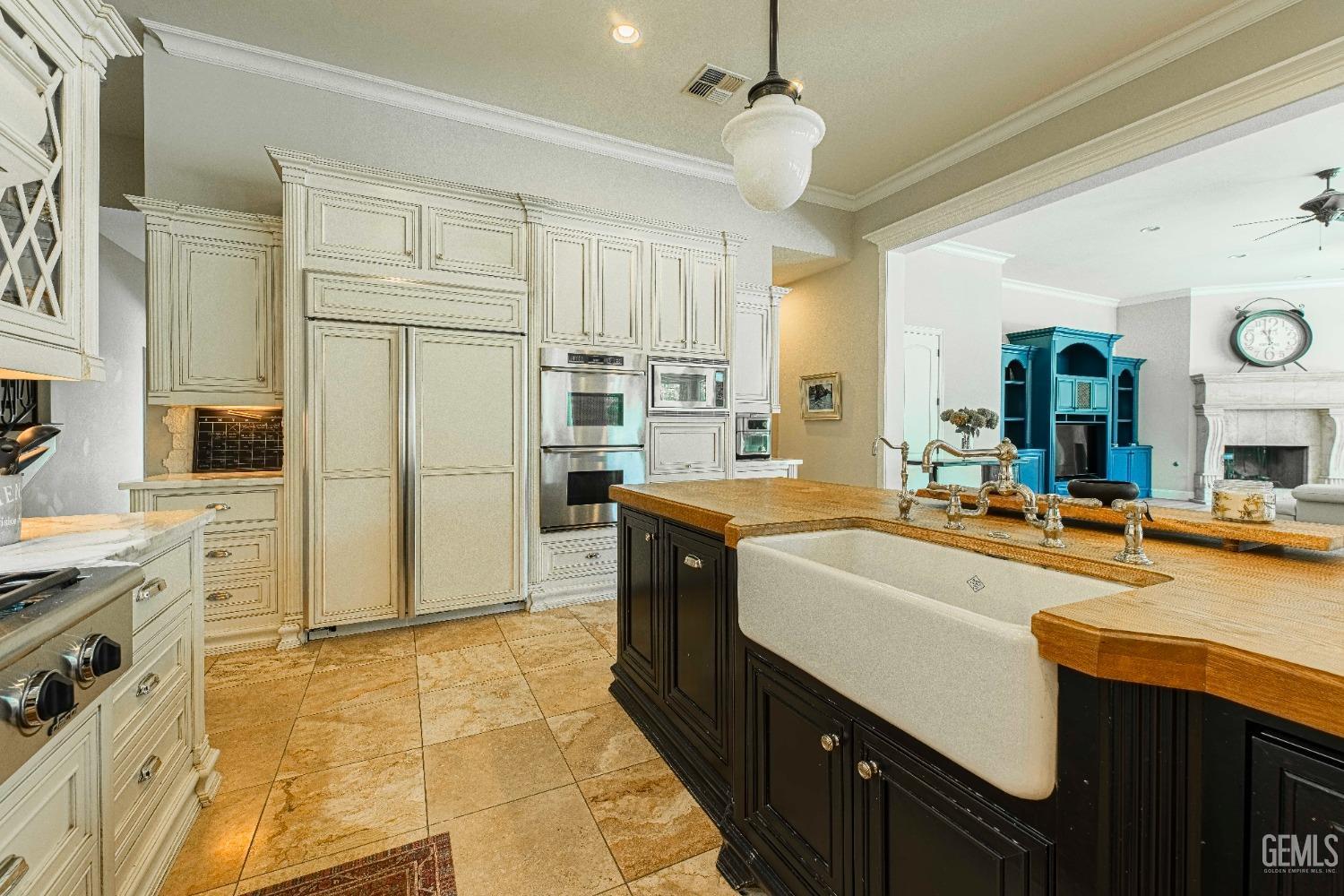 Undisclosed Address Bakersfield, CA 93314 - Photo 25 of 75 a large kitchen with stainless steel appliances lots of counter space and wooden floor
