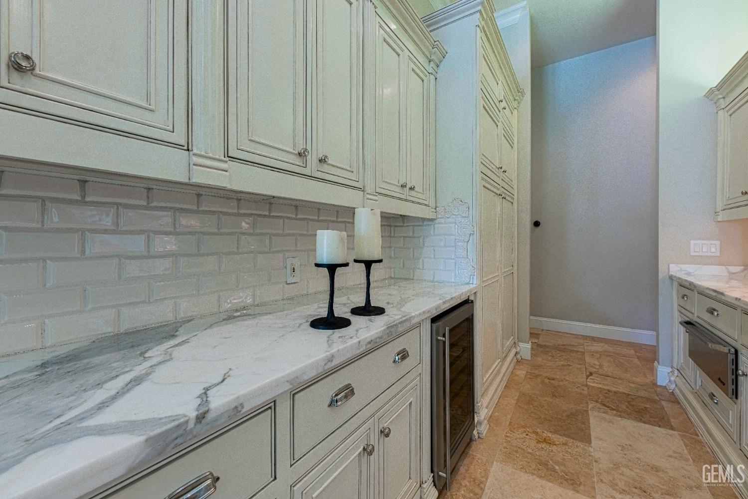 Undisclosed Address Bakersfield, CA 93314 - Photo 26 of 75 a kitchen with granite countertop a sink and a stove