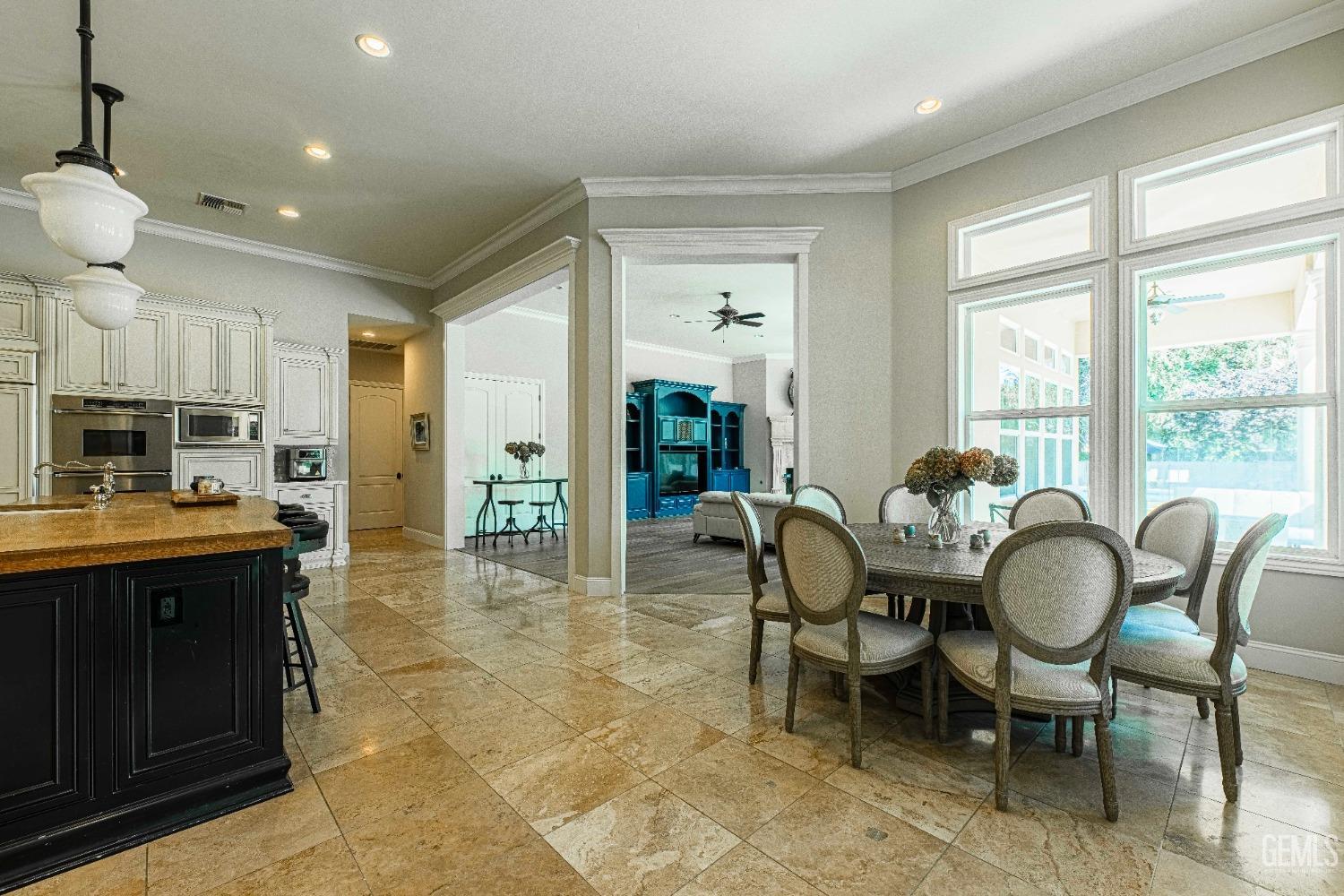 Undisclosed Address Bakersfield, CA 93314 - Photo 28 of 75 a view of a dining room with furniture window and wooden floor