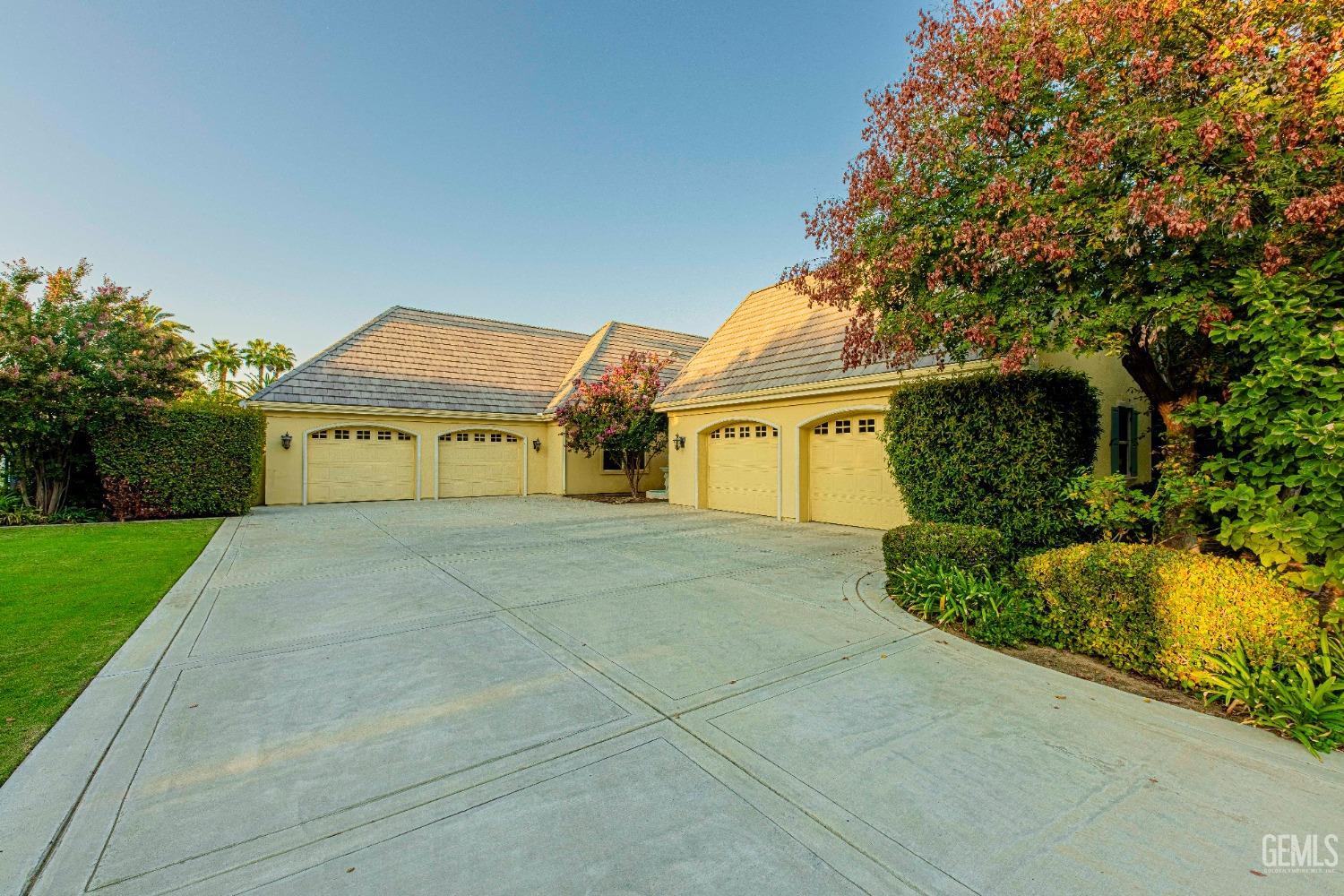 Undisclosed Address Bakersfield, CA 93314 - Photo 3 of 75 a view of a house with a yard and garage