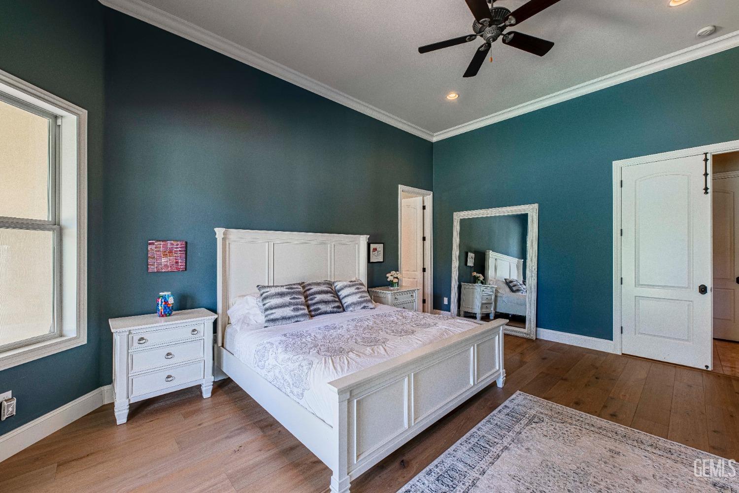 Undisclosed Address Bakersfield, CA 93314 - Photo 41 of 75 a bedroom with a bed and a chandelier