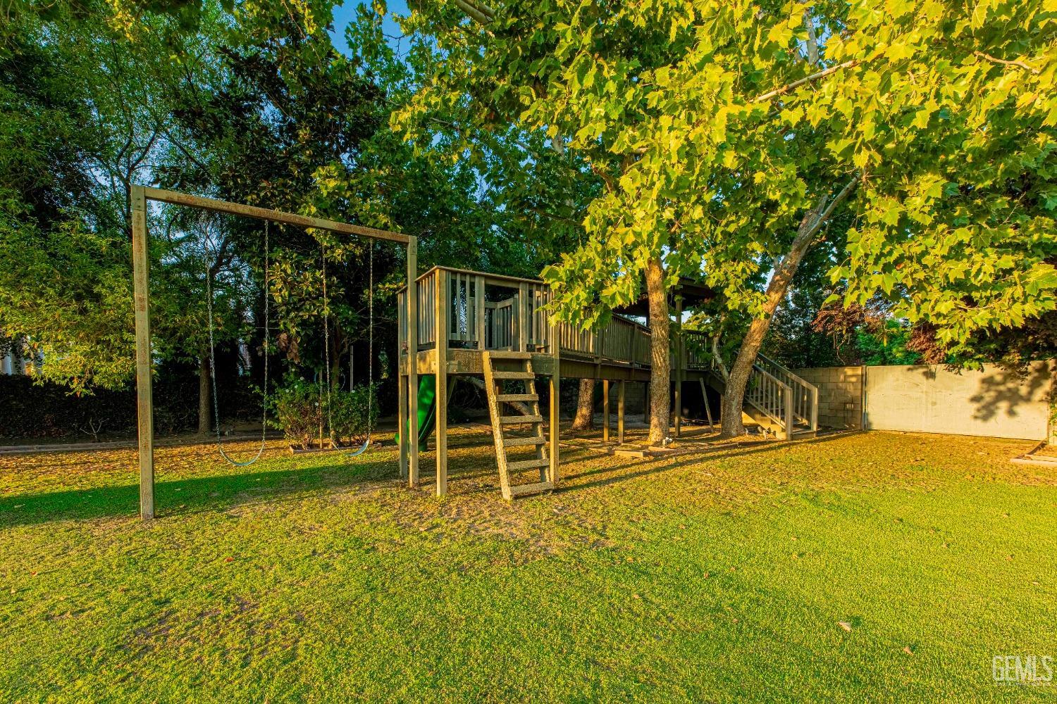 Undisclosed Address Bakersfield, CA 93314 - Photo 62 of 75 a view of a house with a backyard