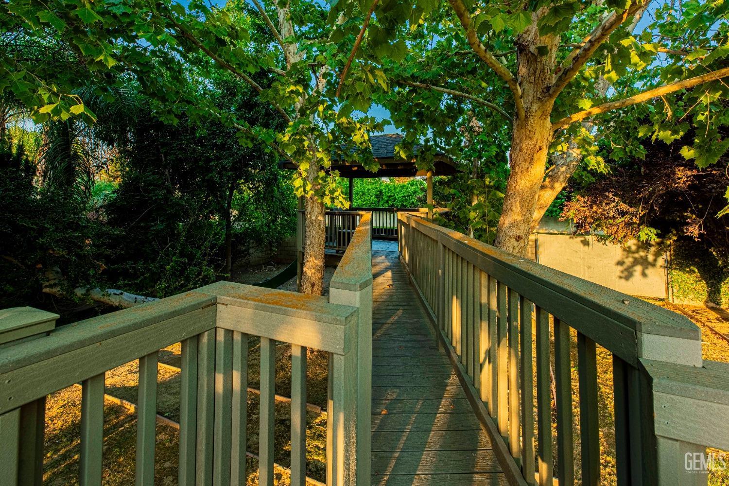 Undisclosed Address Bakersfield, CA 93314 - Photo 66 of 75 a balcony with wooden floor in front of yard